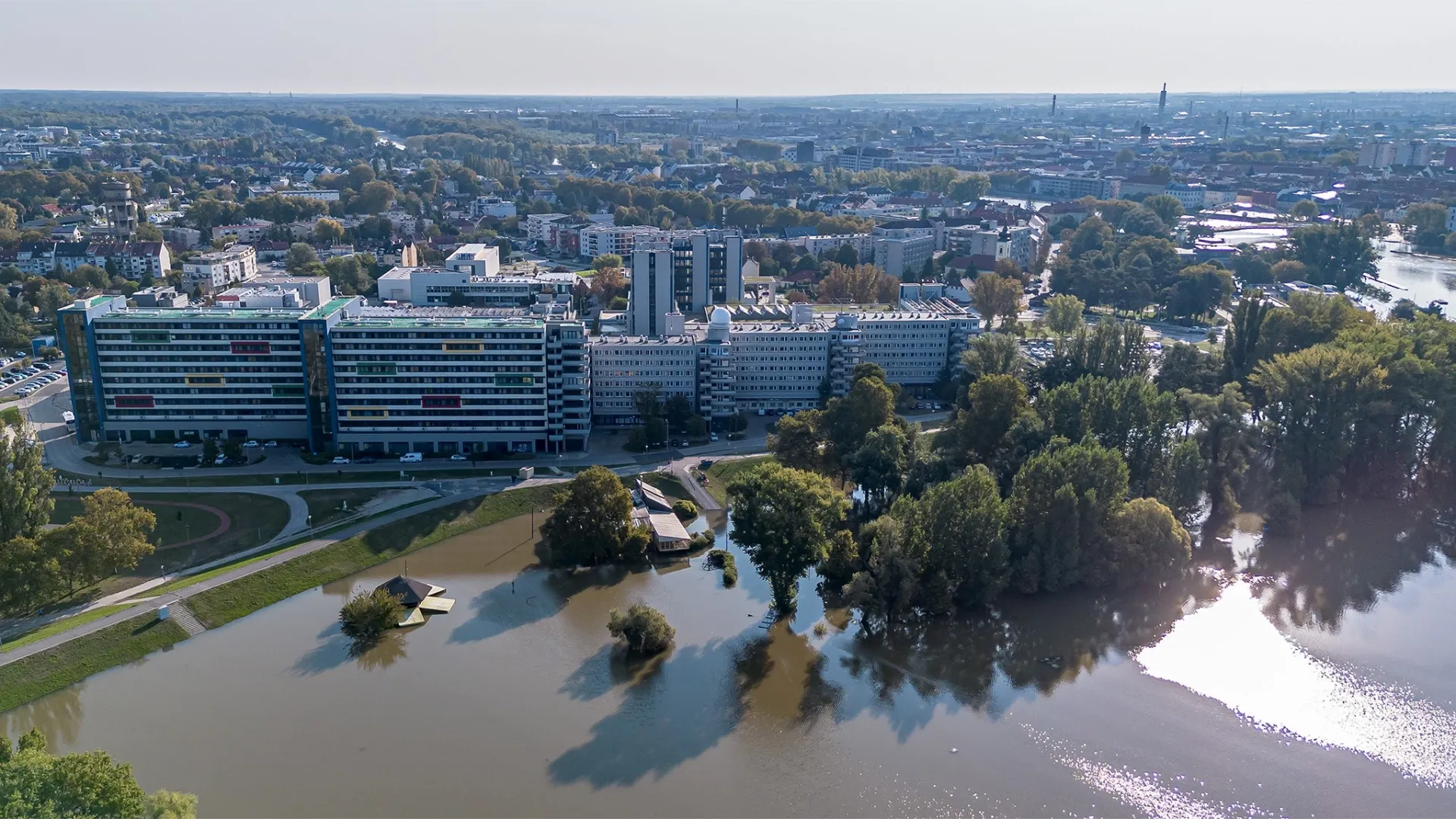 Aerial photo, showing the high water level of the Moson-Danube near the campus of Széchenyi István University in Győr.